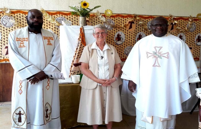 Kay with priests
